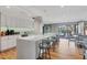 Modern kitchen features a breakfast bar with stainless steel appliances at 101 Benjamin Franklin Dr # 63, Sarasota, FL 34236