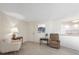 Cozy living room with seating and a pass-through to the kitchen area at 101 Benjamin Franklin Dr # 63, Sarasota, FL 34236