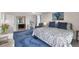Spacious main bedroom with king bed, desk, and ensuite bathroom at 101 Benjamin Franklin Dr # 63, Sarasota, FL 34236