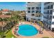 An aerial view of a pool surrounded by lounge chairs offers a relaxing retreat at 101 Benjamin Franklin Dr # 63, Sarasota, FL 34236