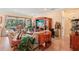 Spacious living room featuring hardwood floors, entertainment center, and comfortable furniture at 10802 Seasons Way, Palmetto, FL 34221