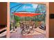 Enclosed patio area featuring an outdoor dining set and a scenic view at 10802 Seasons Way, Palmetto, FL 34221