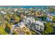 An aerial shot features a home with lush landscaping and scenic views of the surrounding area at 116 Garden Ln, Sarasota, FL 34242