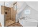 Luxurious bathroom featuring a freestanding tub, shower, and modern fixtures at 116 Garden Ln, Sarasota, FL 34242