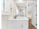 Bathroom featuring white vanity, large mirror, and modern fixtures at 116 Garden Ln, Sarasota, FL 34242