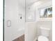 Modern bathroom featuring a glass-enclosed shower and pebble flooring at 116 Garden Ln, Sarasota, FL 34242