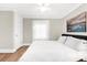 Calm bedroom with hardwood floors, a large window, and contemporary decor that creates a peaceful retreat at 116 Garden Ln, Sarasota, FL 34242