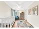 Charming Bedroom with a crib, playful rug, and soft blue accents at 116 Garden Ln, Sarasota, FL 34242