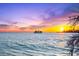 Scenic view of a boat at sea with the beautiful sunsetting in the distance at 116 Garden Ln, Sarasota, FL 34242