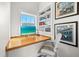 Bright home office with built-in shelving and stylish decor at 116 Garden Ln, Sarasota, FL 34242