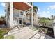 Beautiful outdoor space with multiple stories, palm trees, and plenty of seating at 116 Garden Ln, Sarasota, FL 34242
