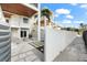 Relaxing outdoor patio featuring comfortable seating, a grill, and access to the interior at 116 Garden Ln, Sarasota, FL 34242
