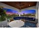 Relaxing outdoor patio featuring comfortable seating, a ceiling fan, and stunning views of the neighborhood at 116 Garden Ln, Sarasota, FL 34242