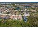 Aerial view of homes in a residential community, showcasing well-maintained landscaping, backyard pools and beautiful lakes at 12022 Medley Ter, Lakewood Ranch, FL 34211