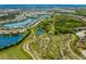 Scenic aerial view of the community featuring multiple ponds, parks, and extensive walking trails at 12022 Medley Ter, Lakewood Ranch, FL 34211