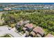 Aerial view of the homes in the community featuring tile roofs, manicured lawns, and tropical landscaping at 12022 Medley Ter, Lakewood Ranch, FL 34211
