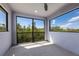 Covered balcony with large sliding glass doors, offering beautiful views of the outdoors at 12022 Medley Ter, Lakewood Ranch, FL 34211