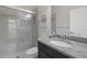 Modern bathroom with granite countertops, a glass-enclosed shower, and neutral colors at 12022 Medley Ter, Lakewood Ranch, FL 34211