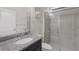 Modern bathroom featuring granite countertop, undermount sink, and glass-enclosed shower at 12022 Medley Ter, Lakewood Ranch, FL 34211