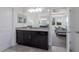 Stylish bathroom featuring a double vanity, neutral color palette, and access to the main bedroom at 12022 Medley Ter, Lakewood Ranch, FL 34211