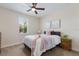 Bright bedroom features modern decor, natural light from the window, and a stylish ceiling fan at 12022 Medley Ter, Lakewood Ranch, FL 34211