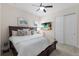 Cozy bedroom with a decorative throw blanket, ample pillows, and a wall-mounted television at 12022 Medley Ter, Lakewood Ranch, FL 34211