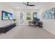 Bright bedroom with a ceiling fan, neutral carpet, and view to balcony at 12022 Medley Ter, Lakewood Ranch, FL 34211