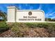 Bob Gardner Community Park sign, with lush landscaping featuring vibrant flowers and mature trees at 12022 Medley Ter, Lakewood Ranch, FL 34211