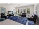 Bright living room with recessed lighting, ceiling fan, shuttered windows, and modern decor at 12022 Medley Ter, Lakewood Ranch, FL 34211