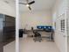 Home office with natural light with built-in desk and three monitors at 12022 Medley Ter, Lakewood Ranch, FL 34211