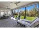 Screened patio with plenty of room to relax outside, including ceiling fans and lawn views at 12022 Medley Ter, Lakewood Ranch, FL 34211
