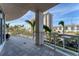 Spacious balcony with glass railings offering city views and relaxing outdoor seating at 1300 Benjamin Franklin Dr # 304, Sarasota, FL 34236