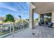Relaxing balcony with seating and views of palm trees and surrounding buildings at 1300 Benjamin Franklin Dr # 304, Sarasota, FL 34236