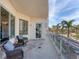 Inviting balcony with comfortable seating, perfect for enjoying the stunning city views at 1300 Benjamin Franklin Dr # 304, Sarasota, FL 34236
