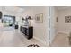 Inviting entryway with tiled flooring, a stylish console table, and elegant decor at 1300 Benjamin Franklin Dr # 304, Sarasota, FL 34236
