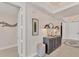 Beautiful foyer featuring tiled floors, a console table with art, and access to other rooms at 1300 Benjamin Franklin Dr # 304, Sarasota, FL 34236