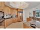 Elegant kitchen featuring stainless steel appliances, granite countertops and bright lighting at 1300 Benjamin Franklin Dr # 304, Sarasota, FL 34236
