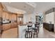 Spacious kitchen with an island bar, wood cabinets, and modern appliances at 1300 Benjamin Franklin Dr # 304, Sarasota, FL 34236
