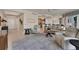 Spacious living room boasting neutral decor, tile flooring, and an open layout to kitchen and dining area at 1300 Benjamin Franklin Dr # 304, Sarasota, FL 34236