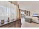 Bright living room with tiled flooring, sheer curtains, and stylish furniture at 1300 Benjamin Franklin Dr # 304, Sarasota, FL 34236