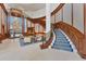 Grand lobby entrance with a sweeping staircase and elegant seating area at 1300 Benjamin Franklin Dr # 304, Sarasota, FL 34236