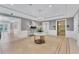A light and airy building lobby is decorated with a chandelier, an elevator, and minimalist décor at 1300 Benjamin Franklin Dr # 304, Sarasota, FL 34236
