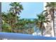 Balcony view showcasing ocean and palm trees, highlighting the property's desirable coastal location at 1300 Benjamin Franklin Dr # 304, Sarasota, FL 34236