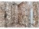 Luxurious marble tiled shower featuring a rainfall showerhead and sleek fixtures at 1300 Benjamin Franklin Dr # 304, Sarasota, FL 34236