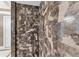 Deluxe walk-in shower featuring dual shower heads, beautiful tile work, and a glass door at 1300 Benjamin Franklin Dr # 304, Sarasota, FL 34236