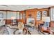 Comfortable sitting area with fireplace, custom built-ins, and stylish decor at 1300 Benjamin Franklin Dr # 304, Sarasota, FL 34236