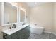 Bathroom featuring a soaking tub, double vanity and decorative tile flooring at 1301 12Th S St, St Petersburg, FL 33705