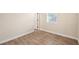 Bright bedroom featuring wood-look tile flooring and a window for natural light at 1301 12Th S St, St Petersburg, FL 33705
