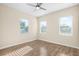 Well-lit bedroom with a ceiling fan and large windows at 1301 12Th S St, St Petersburg, FL 33705