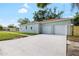 Charming home exterior with a long driveway leading to an attached two-car garage at 1301 12Th S St, St Petersburg, FL 33705